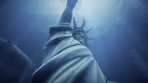 Statue of Liberty submerged underwater surrounded by a school of fish in the 'Underwater Liberty' virtual reality experience.